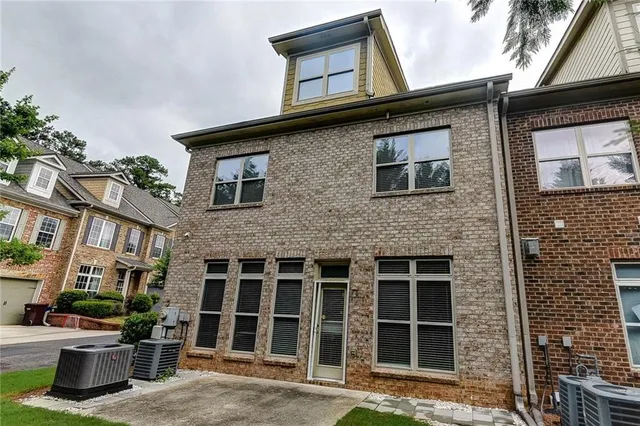 a front view of a house with a large window