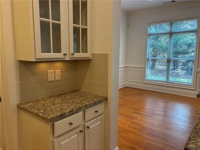 workspace with wooden floor and windows