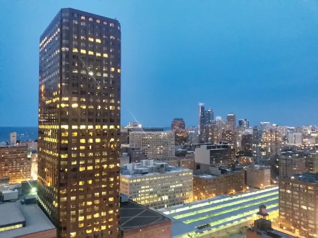 a view of swimming pool outdoor outdoor seating and city view