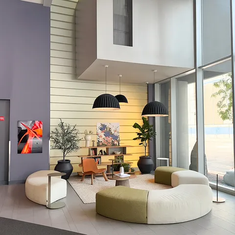 a living room with furniture and a large window