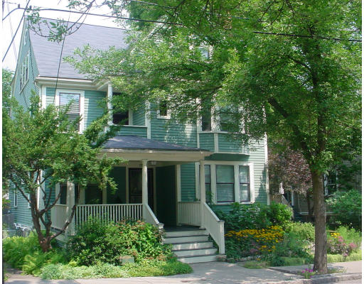 17 Milton Road Brookline, MA 02445 - Photo 1 of 17 a front view of a house with a yard and potted plants
