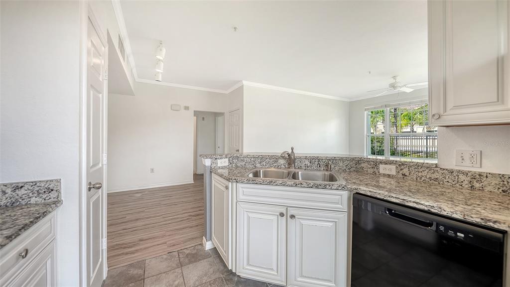 5501 Rosehill Road, Unit 105 Sarasota, FL 34233 - Photo 16 of 45 a kitchen with a sink and cabinets
