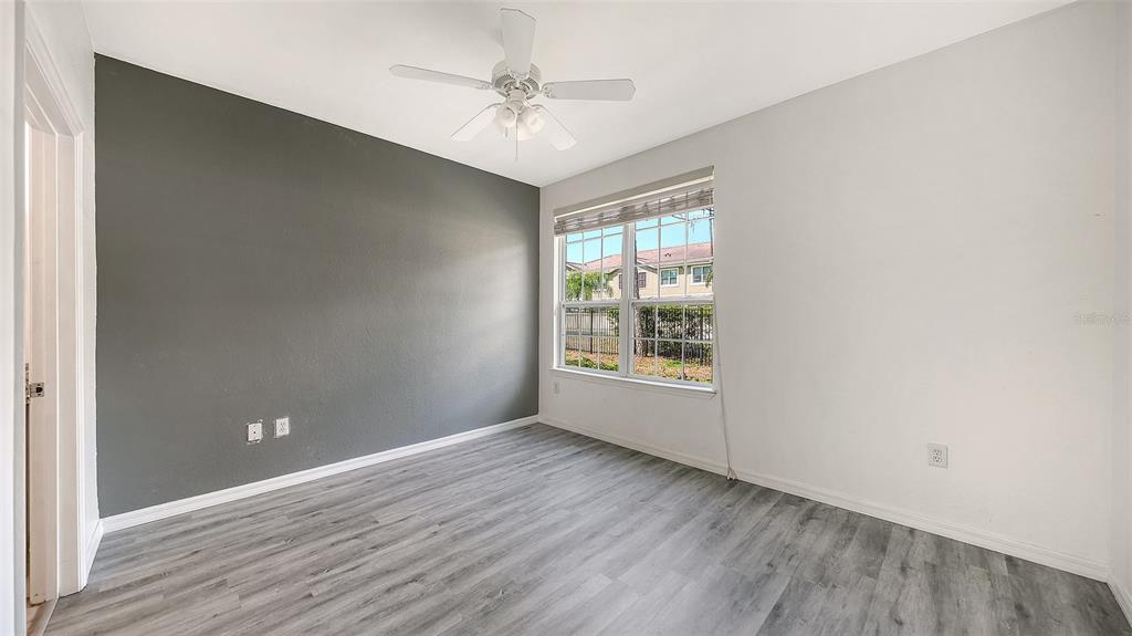 5501 Rosehill Road, Unit 105 Sarasota, FL 34233 - Photo 19 of 45 a view of an empty room with a window