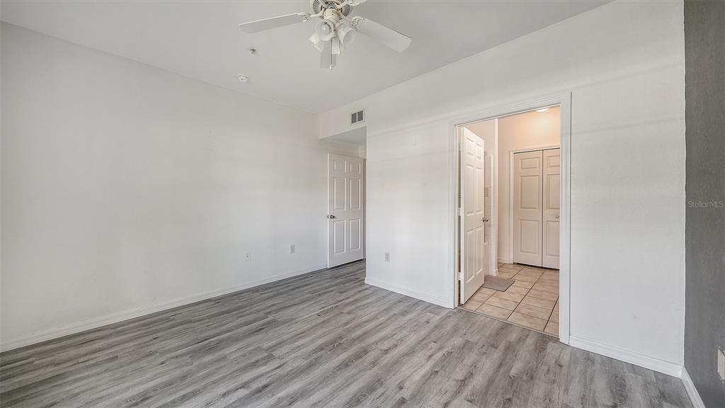 5501 Rosehill Road, Unit 105 Sarasota, FL 34233 - Photo 21 of 45 wooden floor in an empty room with a window
