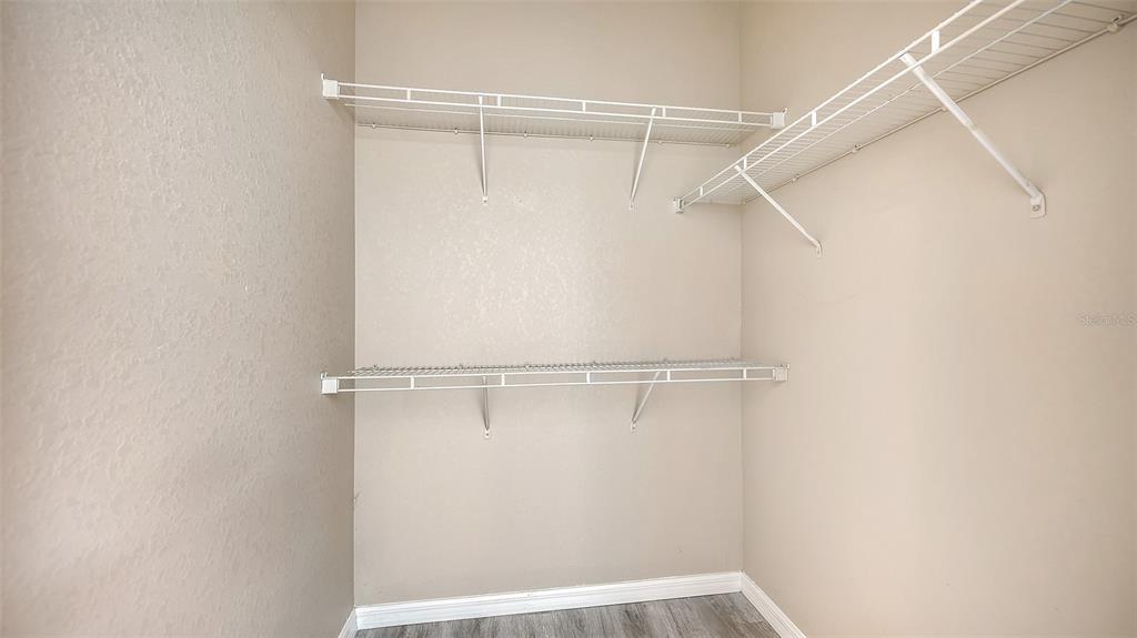 5501 Rosehill Road, Unit 105 Sarasota, FL 34233 - Photo 25 of 45 a view of an empty walk in closet