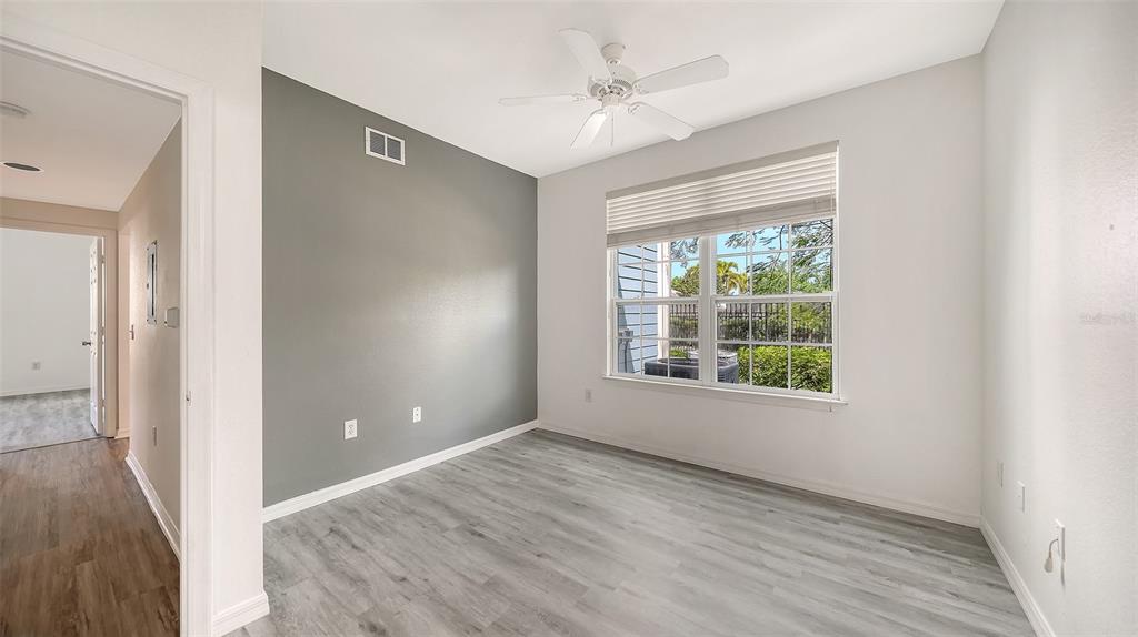 5501 Rosehill Road, Unit 105 Sarasota, FL 34233 - Photo 28 of 45 a view of an empty room with a window