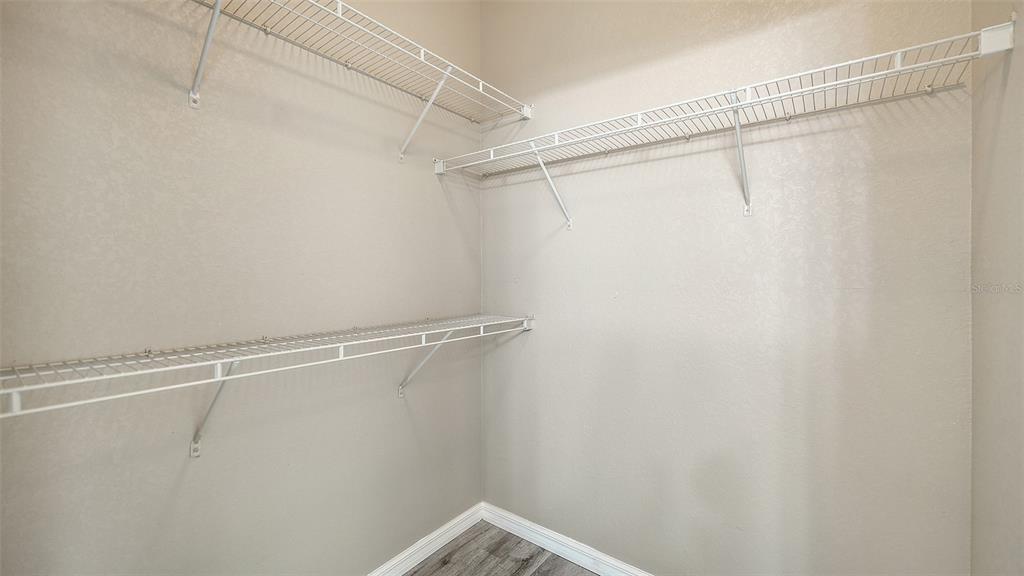 5501 Rosehill Road, Unit 105 Sarasota, FL 34233 - Photo 33 of 45 a view of a room with racks on the wall