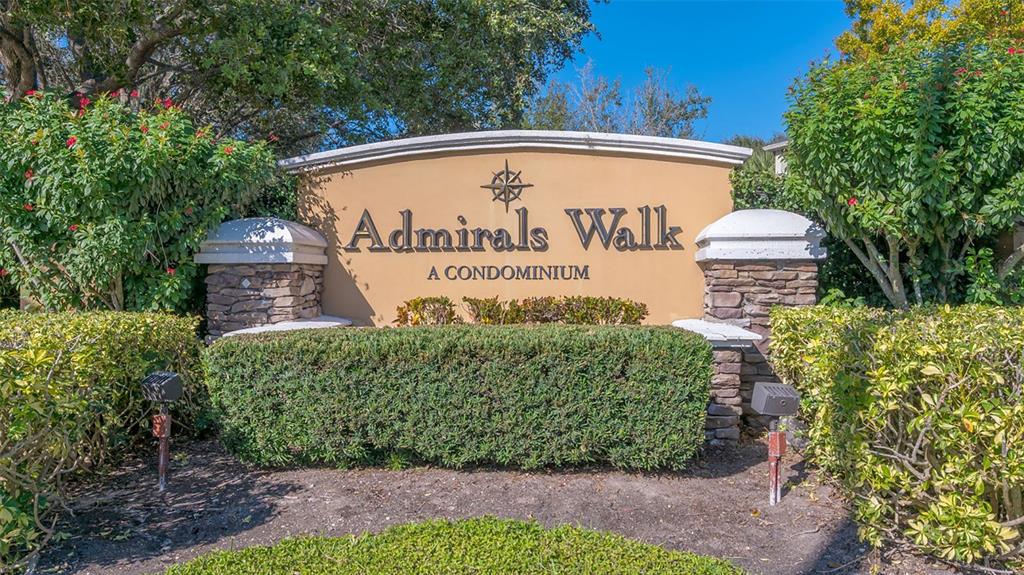 5501 Rosehill Road, Unit 105 Sarasota, FL 34233 - Photo 34 of 45 a sign on the side of the road