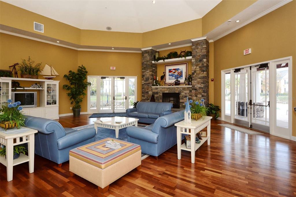 5501 Rosehill Road, Unit 105 Sarasota, FL 34233 - Photo 38 of 45 a living room with furniture and a flat screen tv