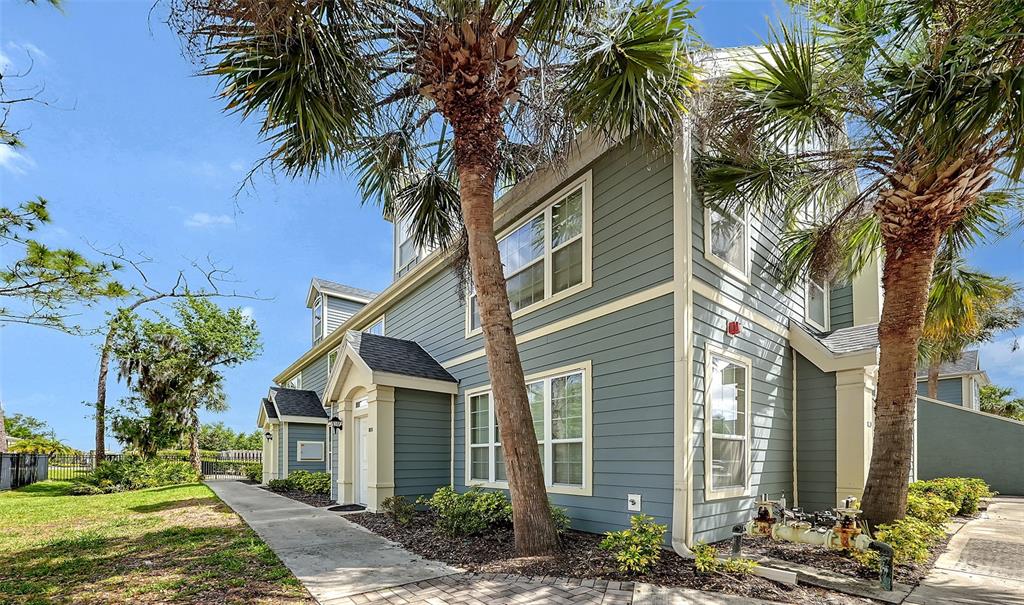 5501 Rosehill Road, Unit 105 Sarasota, FL 34233 - Photo 4 of 45 a front view of a house with a tree