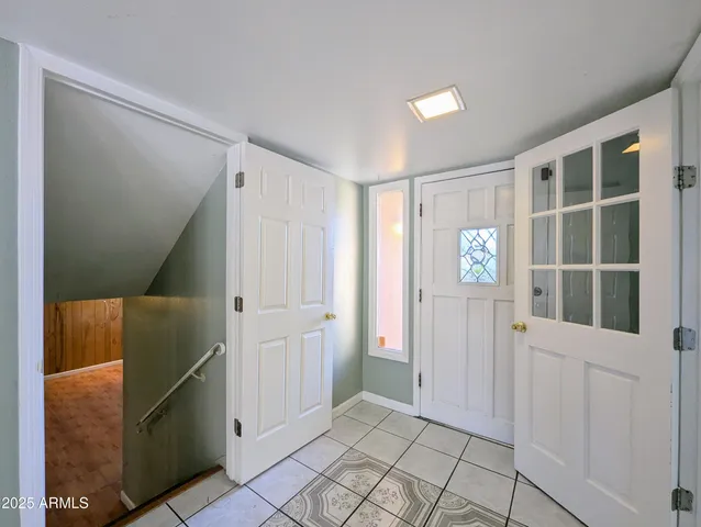 a view of an empty room with a fireplace