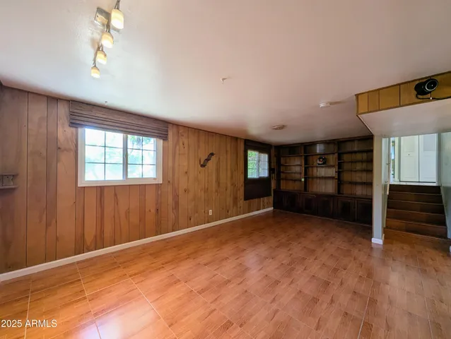 a bathroom with a sink toilet a mirror and shower