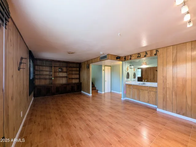 a bathroom with a sink toilet and mirror