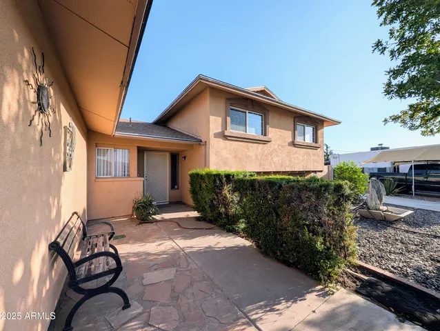 a front view of house with yard outdoor seating and barbeque oven