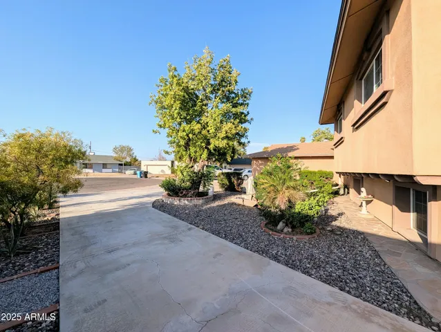 a view of balcony with furniture and a potted plant