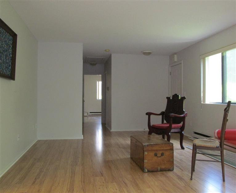 65 Round House Road, Unit 65 Bourne, MA 02532 - Photo 6 of 18 a living room with furniture and a wooden floor