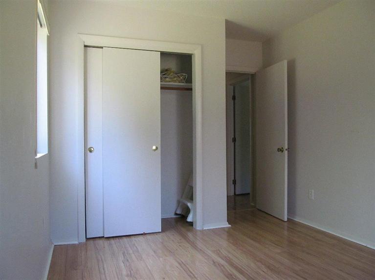 65 Round House Road, Unit 65 Bourne, MA 02532 - Photo 10 of 18 a view of an empty room with wooden floor and closet
