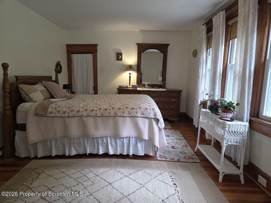 229 East Mountain Road Scranton, PA 18505 - Photo 27 of 47 a bedroom with a bed a potted plant on dresser and a window