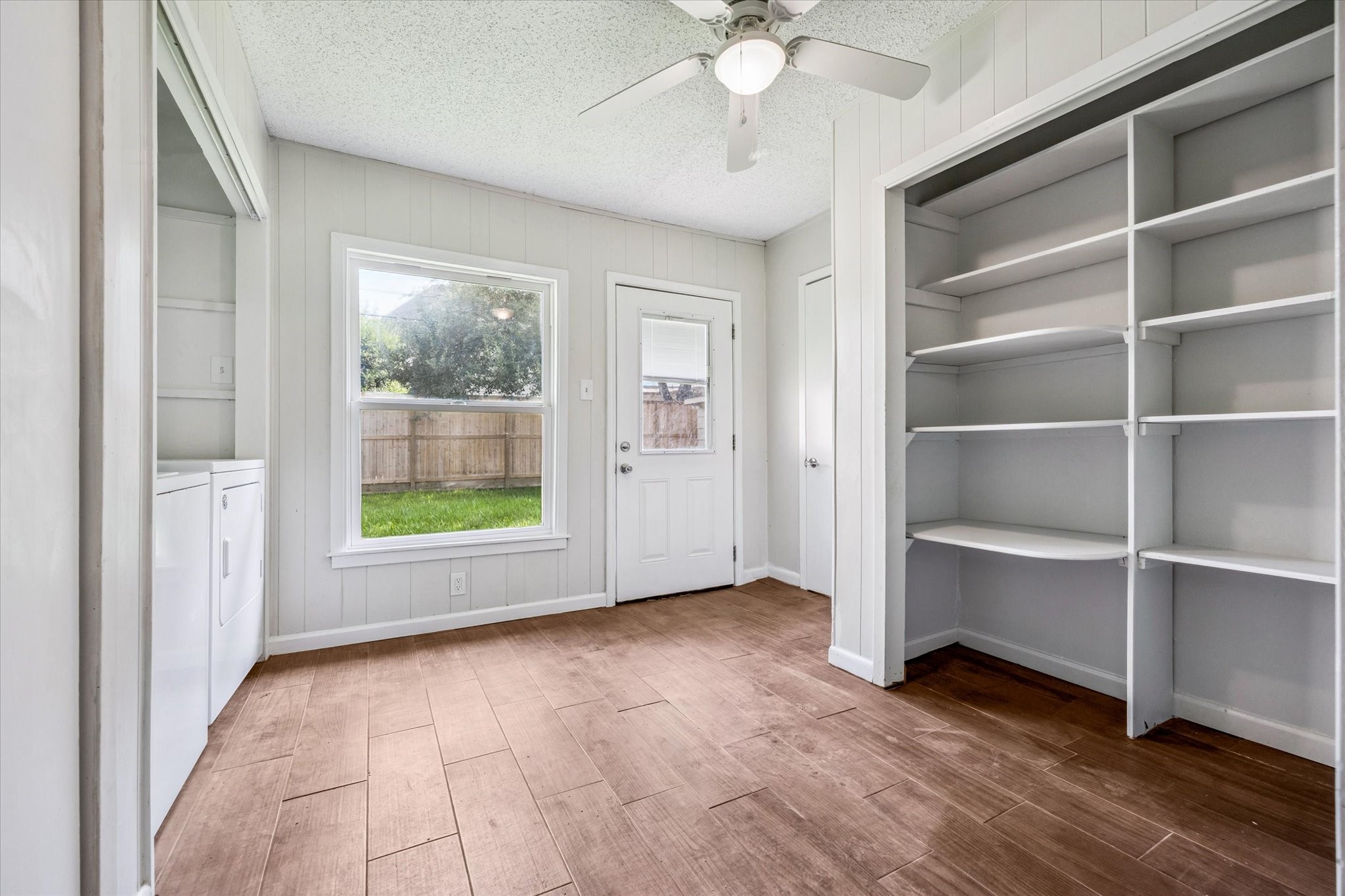 3607 Blue Bonnet Boulevard Houston, TX 77025 - Photo 12 of 14 a view of an empty room with a window and wooden floor