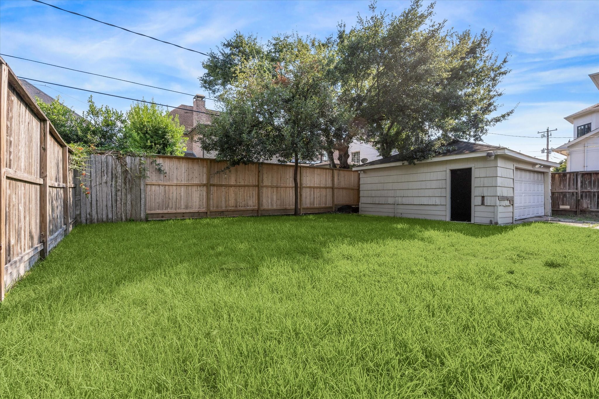 3607 Blue Bonnet Boulevard Houston, TX 77025 - Photo 13 of 14 a view of a backyard with a small cabin and a chair