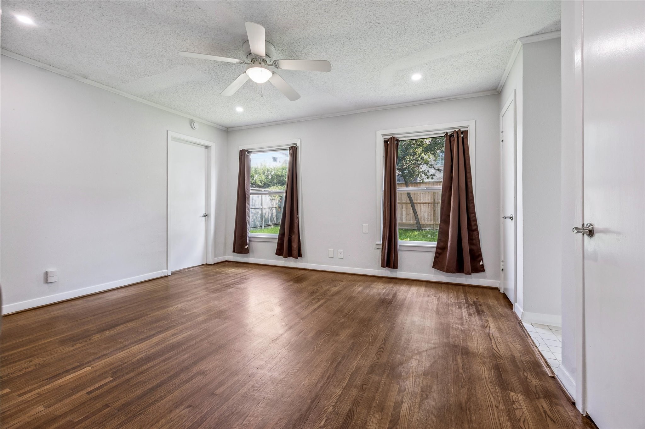 3607 Blue Bonnet Boulevard Houston, TX 77025 - Photo 6 of 14 a view of an empty room with wooden floor