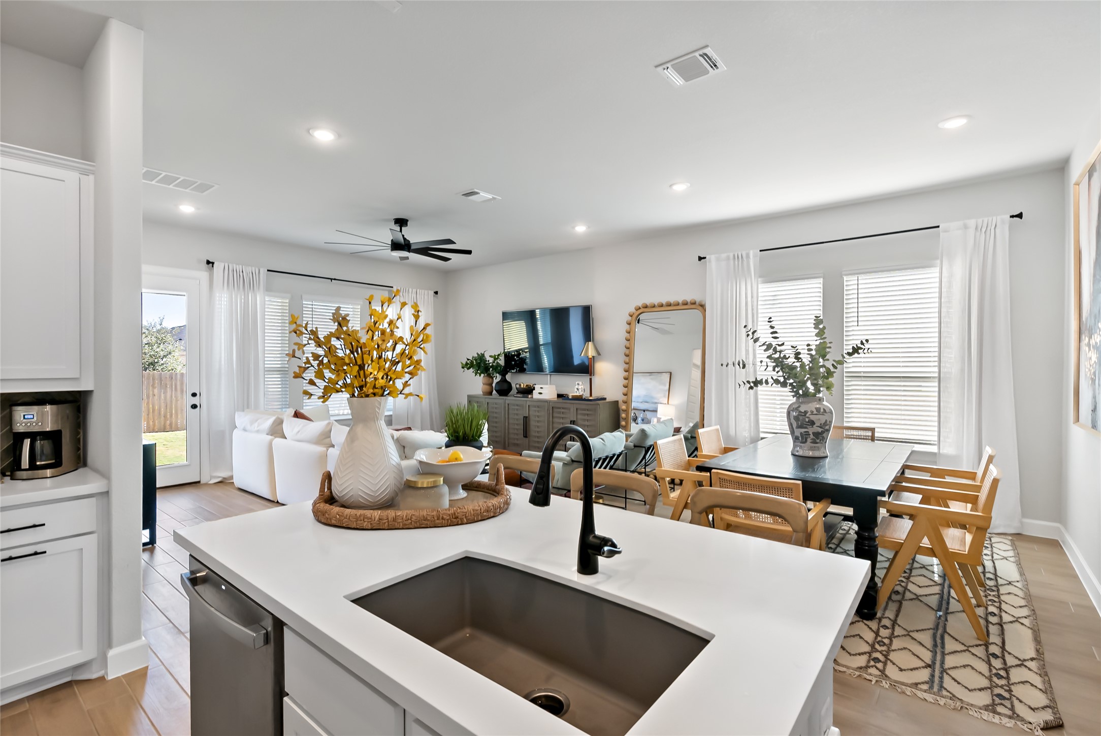 163 Cotton Tree Terrace Dripping Springs, TX 78620 - Photo 30 of 30 a living room with kitchen island furniture and a fireplace