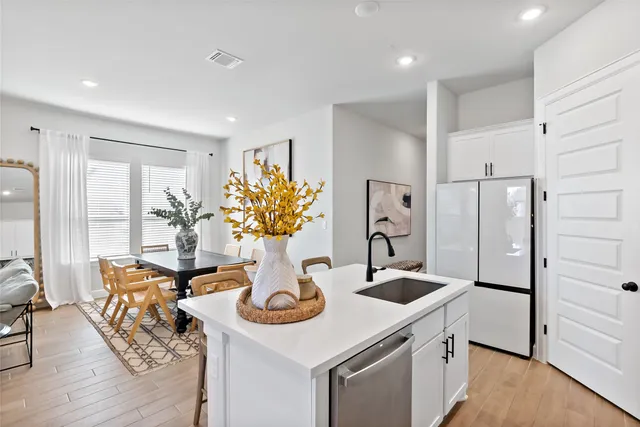 a living room with kitchen island furniture and a fireplace