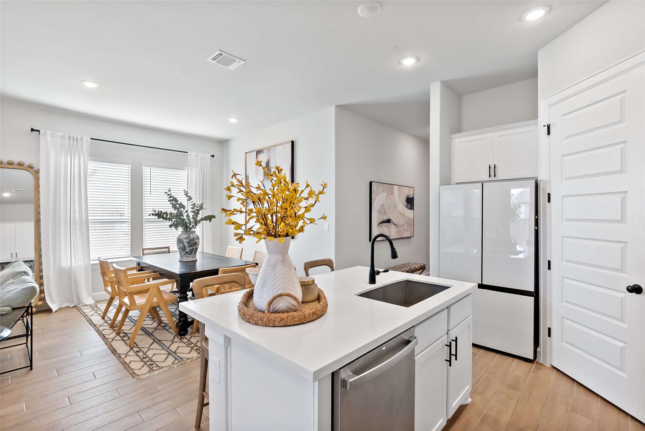 163 Cotton Tree Terrace Dripping Springs, TX 78620 - Photo 13 of 30 a kitchen with a table and chairs