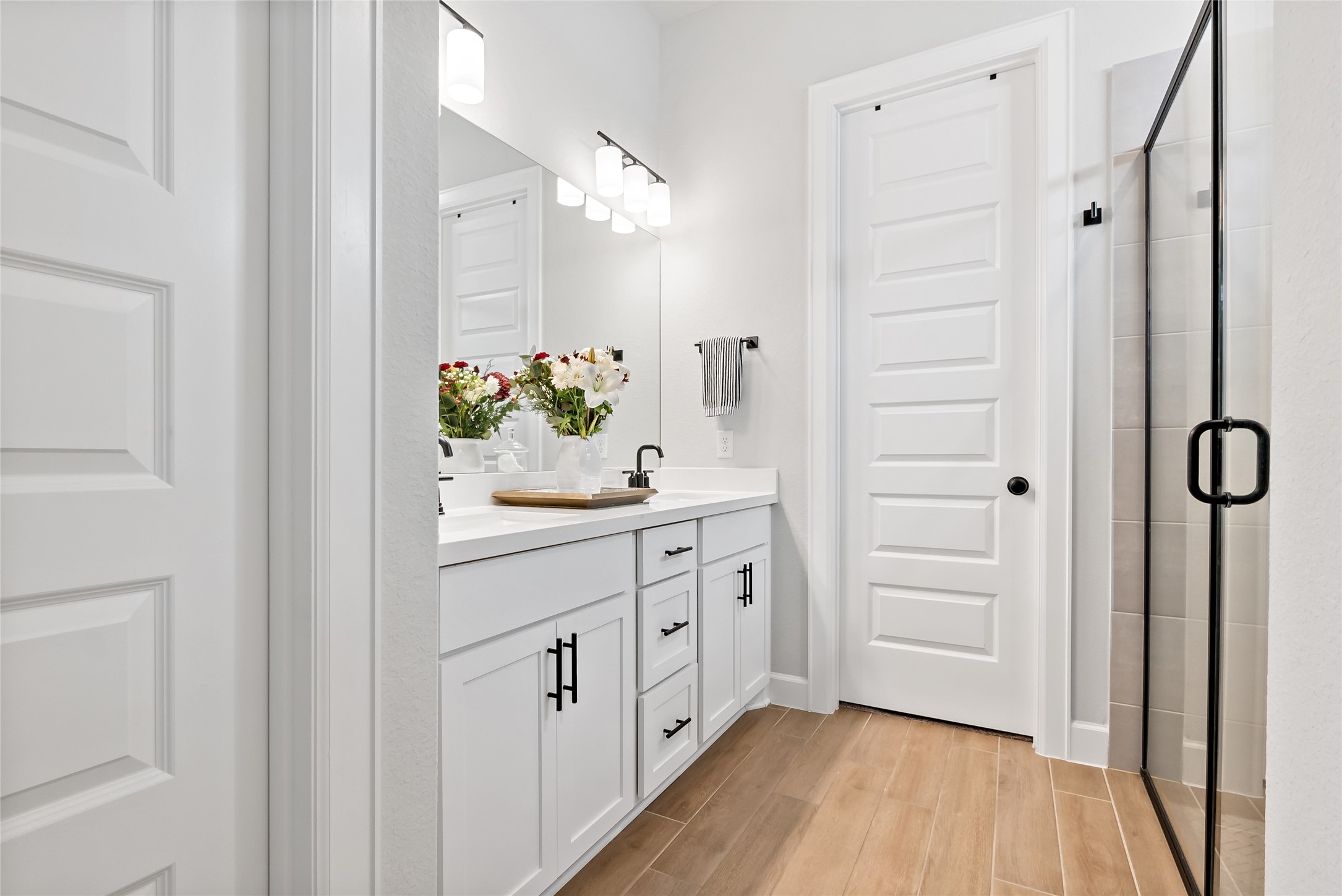 163 Cotton Tree Terrace Dripping Springs, TX 78620 - Photo 21 of 30 a spacious bathroom with a double vanity sink mirror and toilet