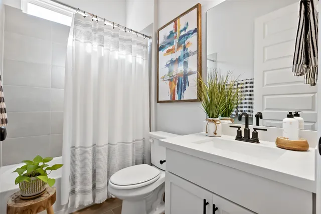 a bedroom with furniture and a window