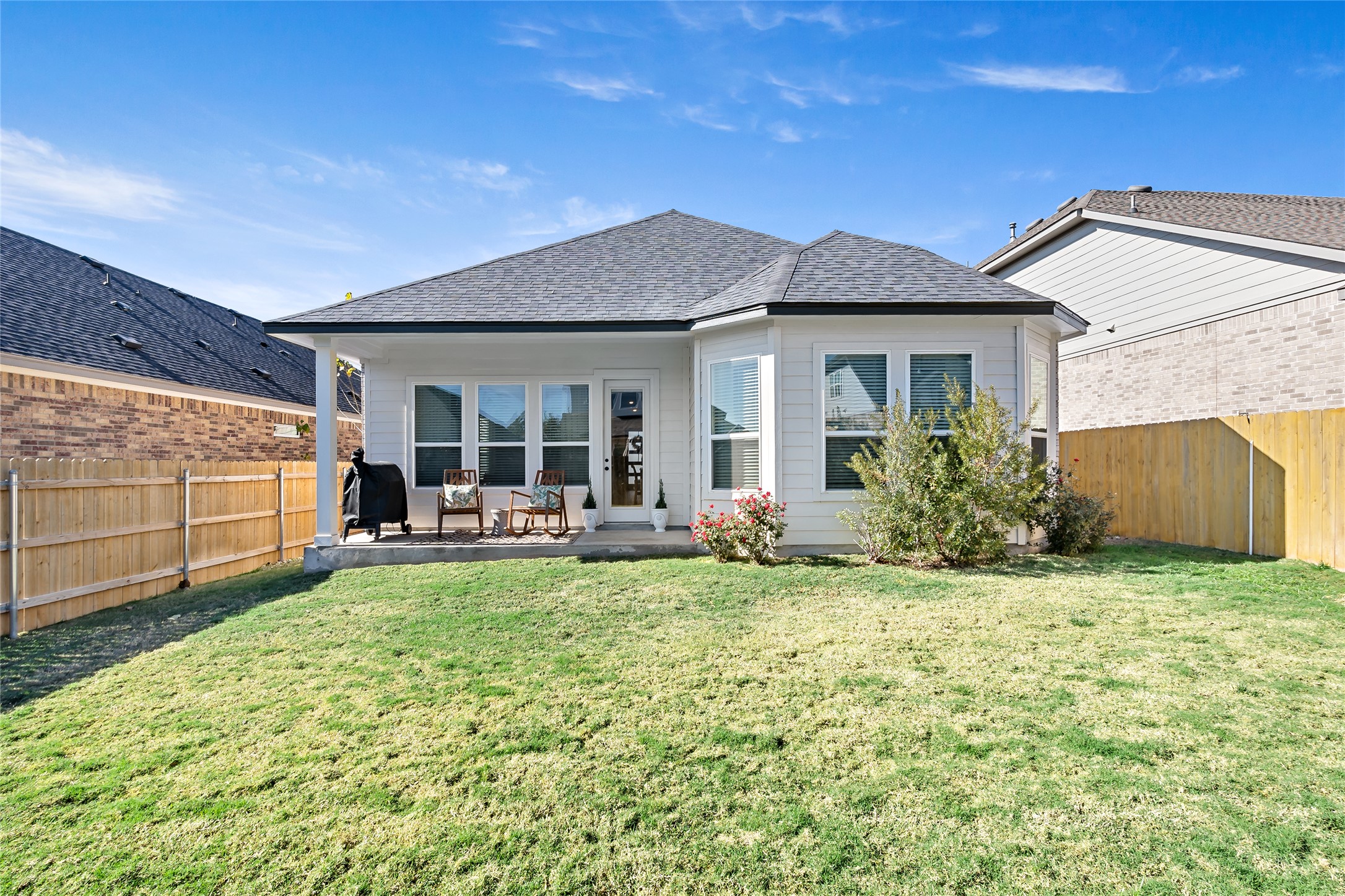 163 Cotton Tree Terrace Dripping Springs, TX 78620 - Photo 28 of 30 a view of a house with backyard porch and garden