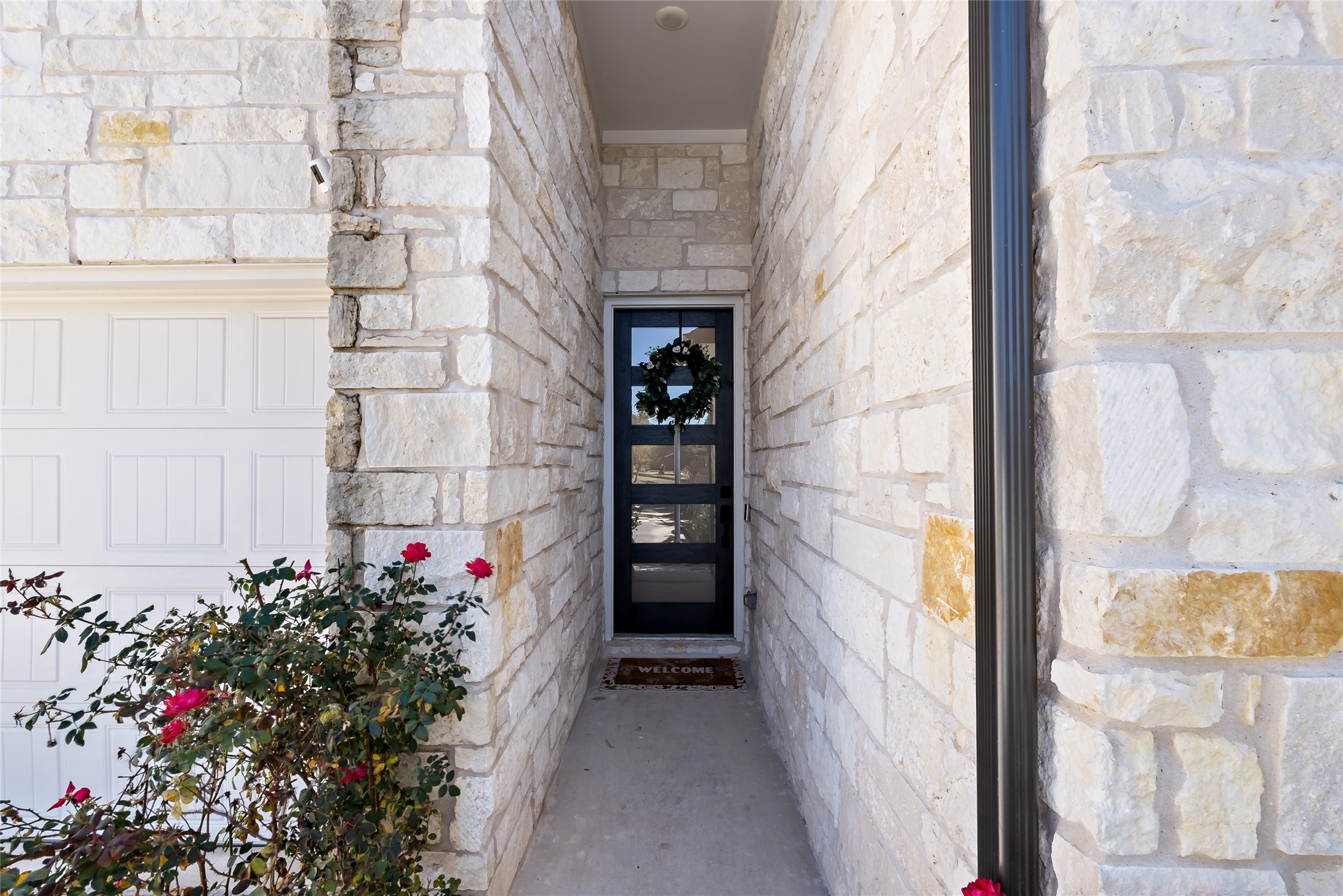 163 Cotton Tree Terrace Dripping Springs, TX 78620 - Photo 3 of 30 a view of a door of the house
