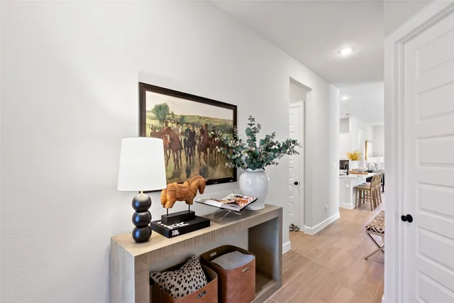 a living room with furniture and flowers