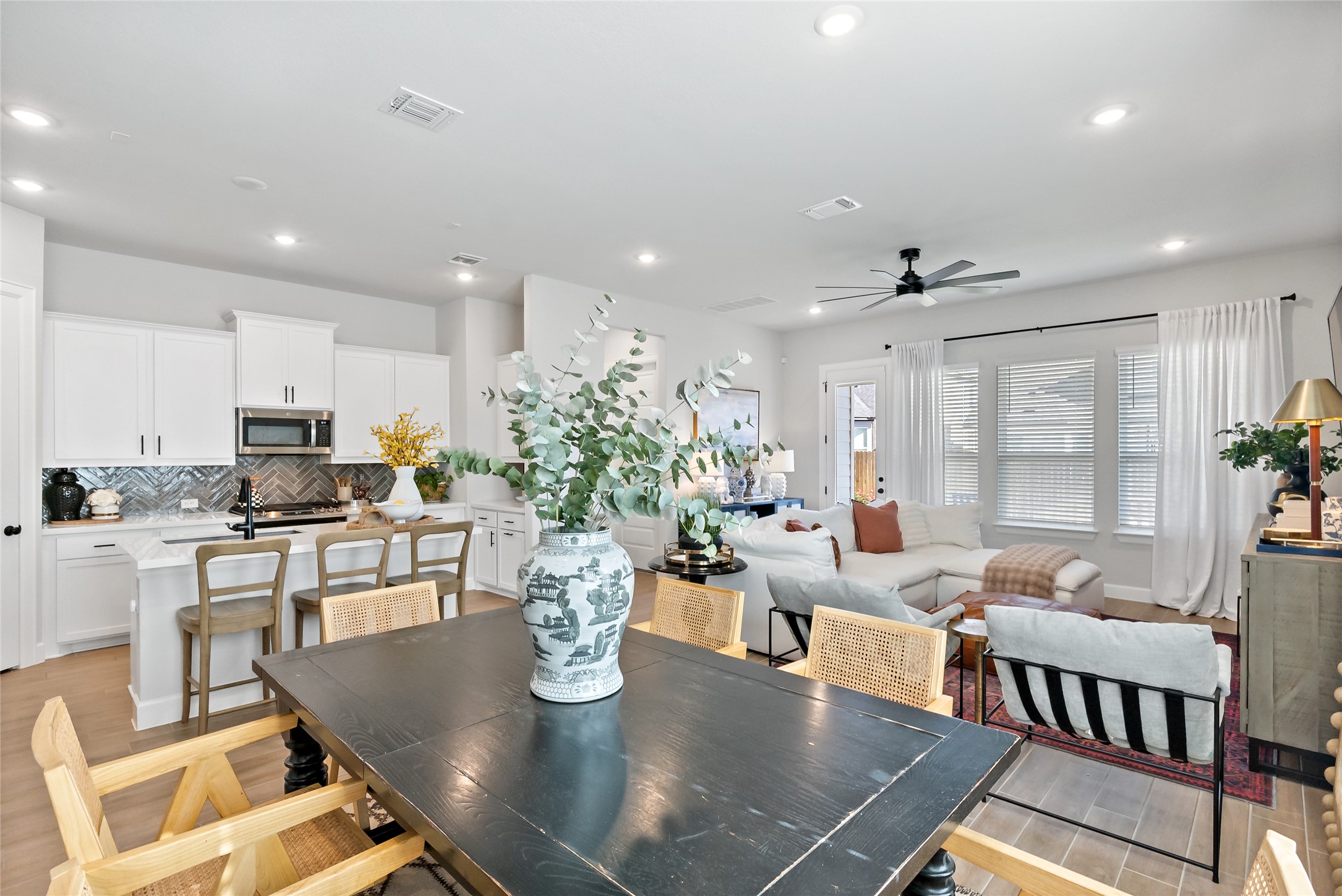 163 Cotton Tree Terrace Dripping Springs, TX 78620 - Photo 8 of 30 a living room with dining room and wooden floor