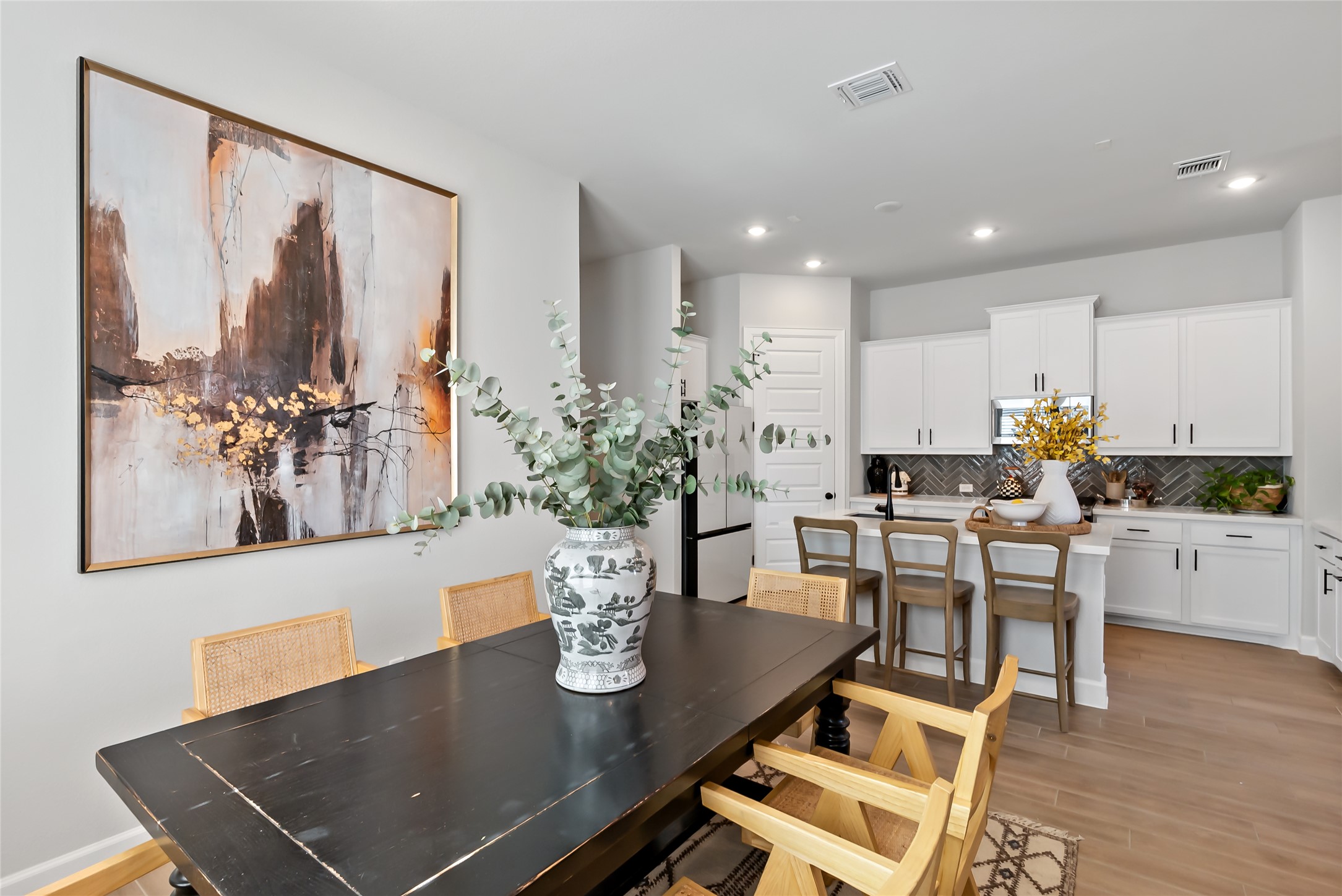 163 Cotton Tree Terrace Dripping Springs, TX 78620 - Photo 9 of 30 a view of a dining room with furniture and wooden floor