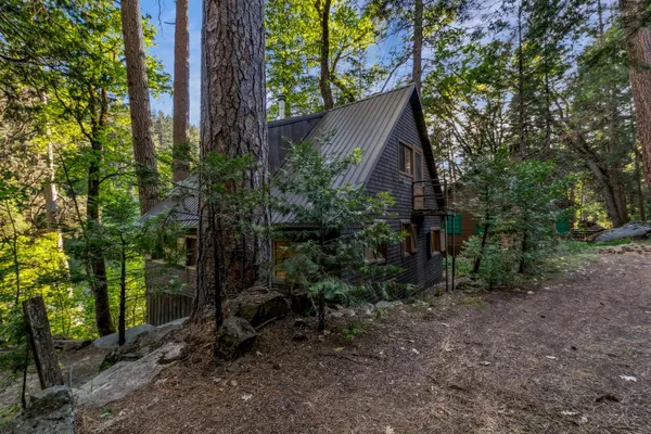 a backyard of a house with lots of green space