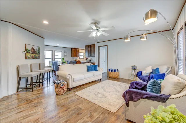 a bedroom with furniture and a wooden floor