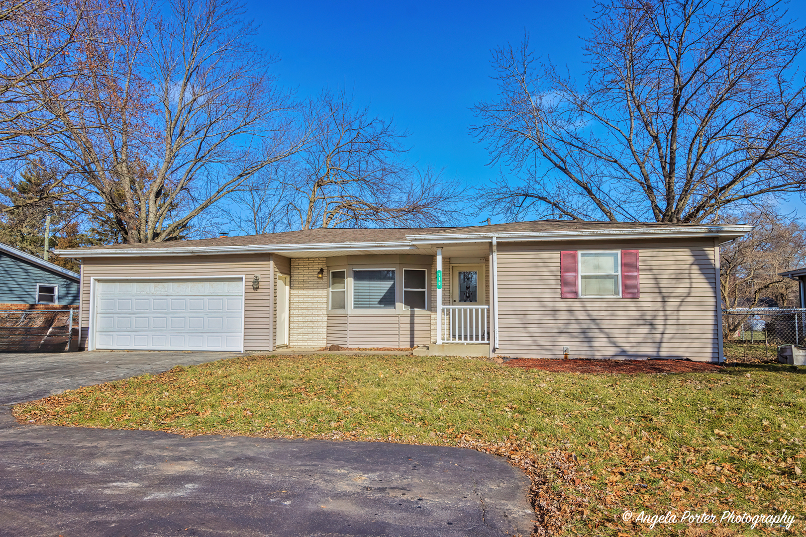 front view of a house with a yard