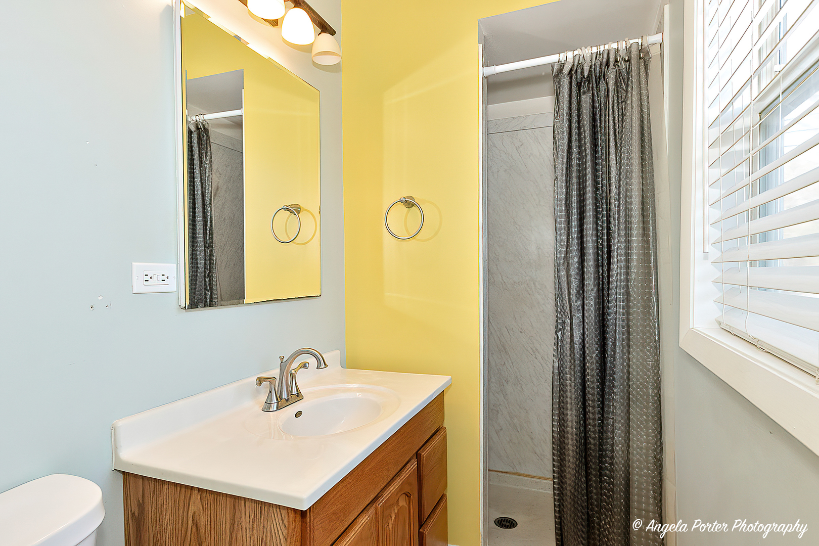 110 Bay Road McHenry, IL 60051 - Photo 15 of 28 a bathroom with a sink vanity and a mirror