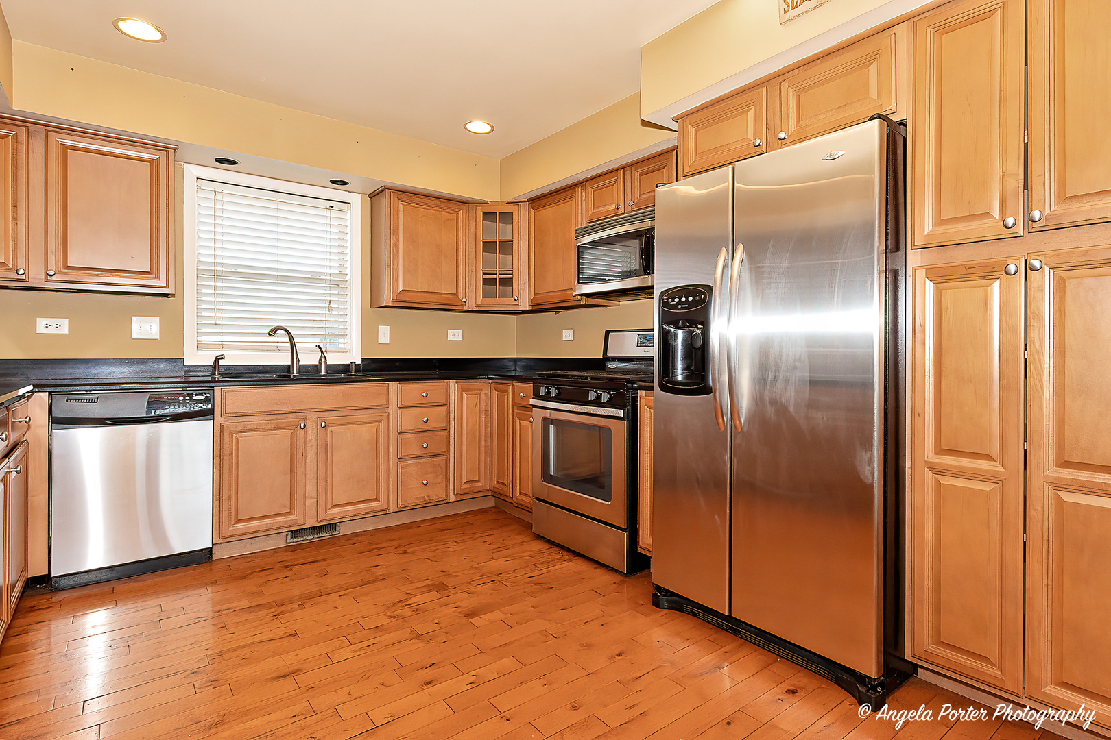 110 Bay Road McHenry, IL 60051 - Photo 5 of 28 a kitchen with granite countertop stainless steel appliances a refrigerator and cabinets