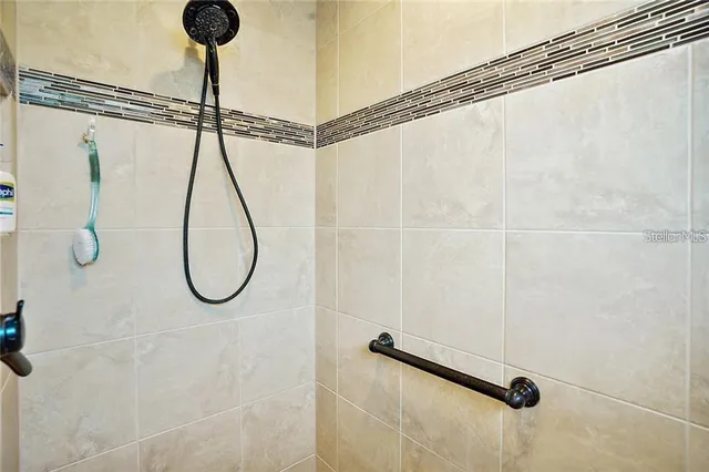a bathroom with a shower and a shower