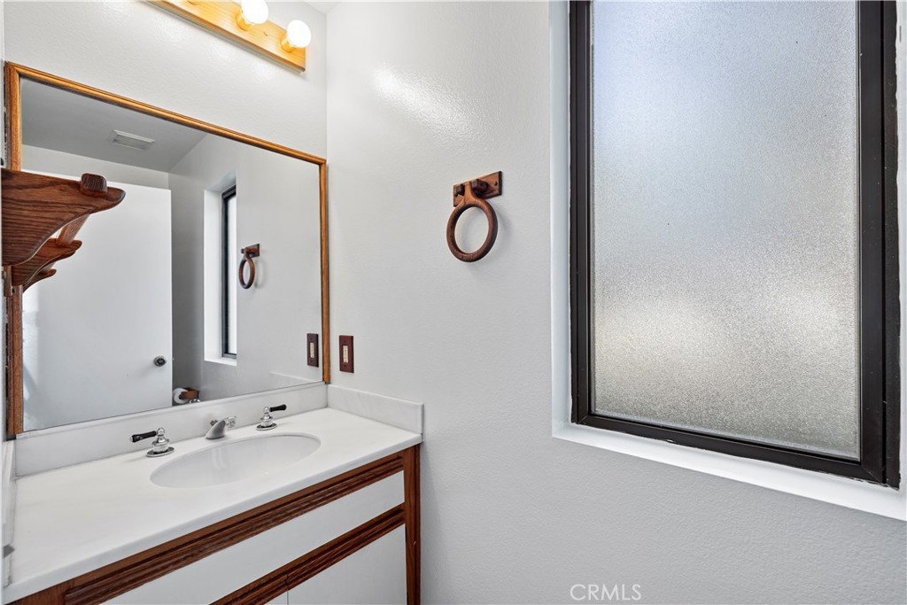 123 Fallingstar Irvine, CA 92614 - Photo 19 of 25 a bathroom with a sink and mirror