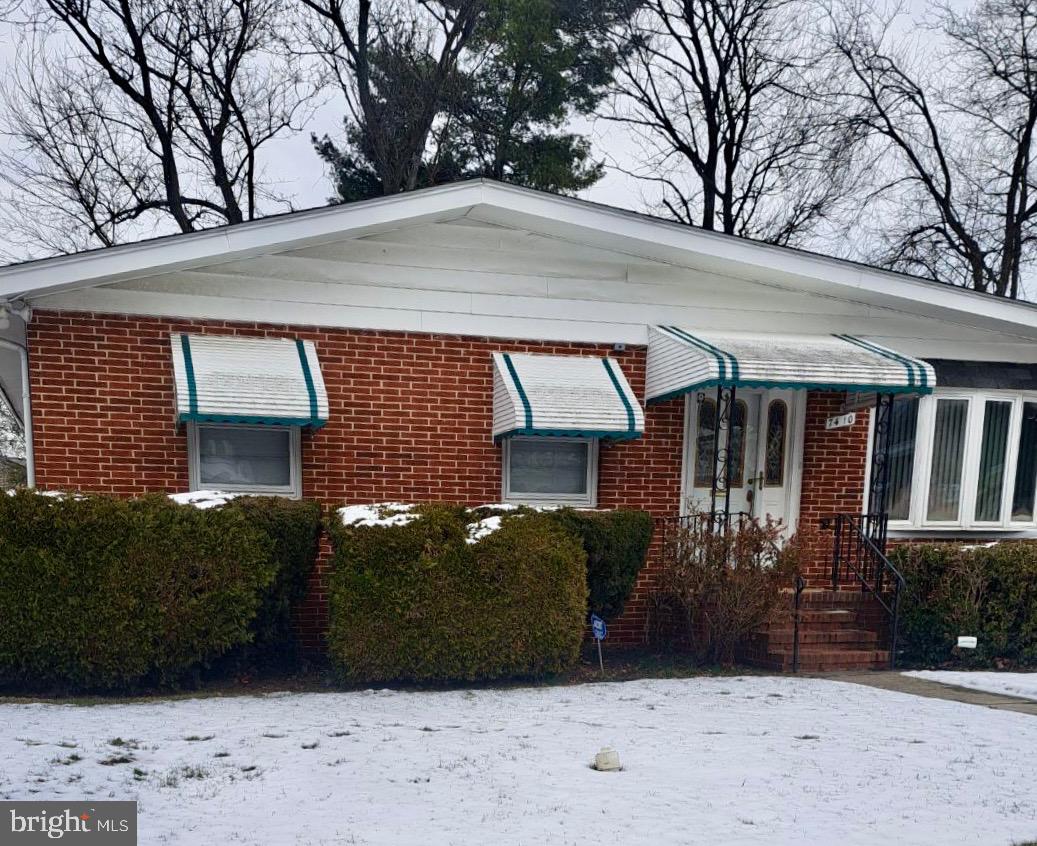 7410 Castlemoor Road Windsor Mill, MD 21244 - Photo 2 of 2 a view of a house with a large tree