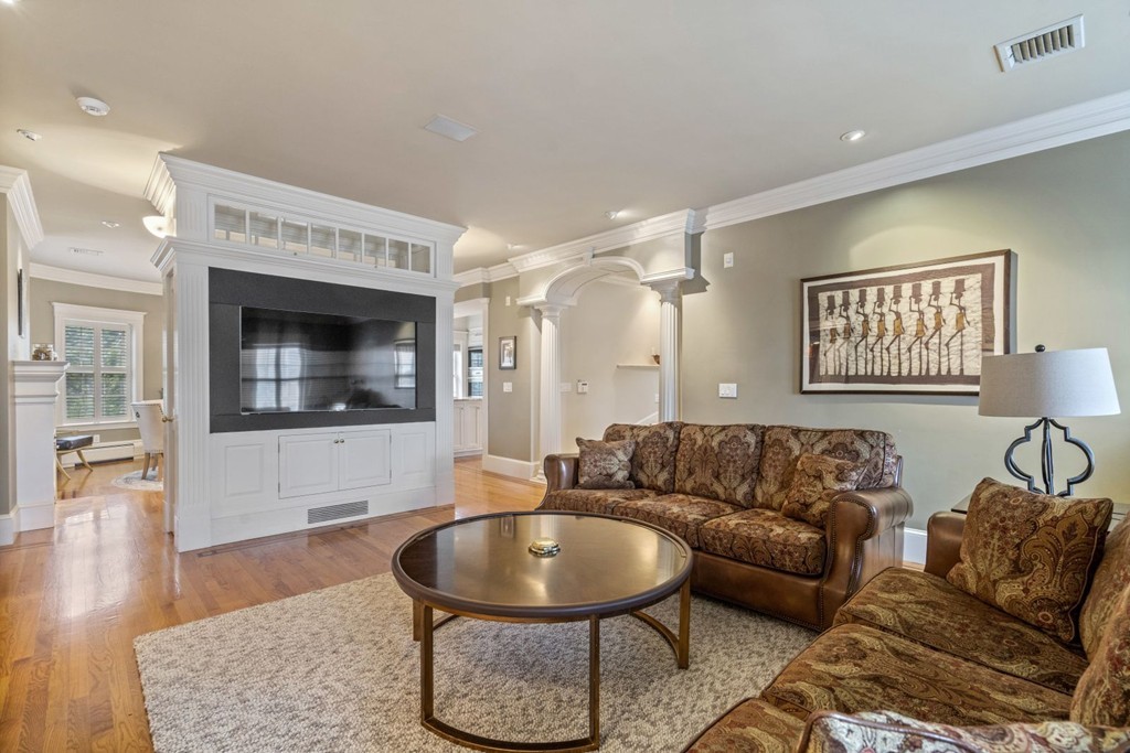 6 Monument Square, Unit 4 Boston, MA 02129 - Photo 11 of 37 a living room with furniture and a fireplace