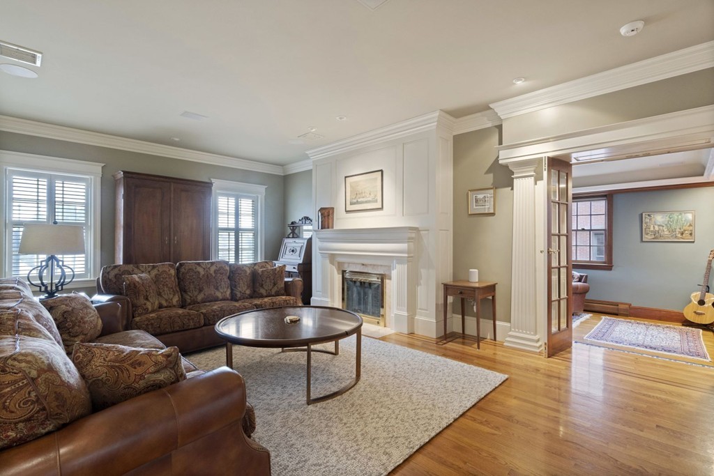 6 Monument Square, Unit 4 Boston, MA 02129 - Photo 12 of 37 a living room with furniture and a fireplace