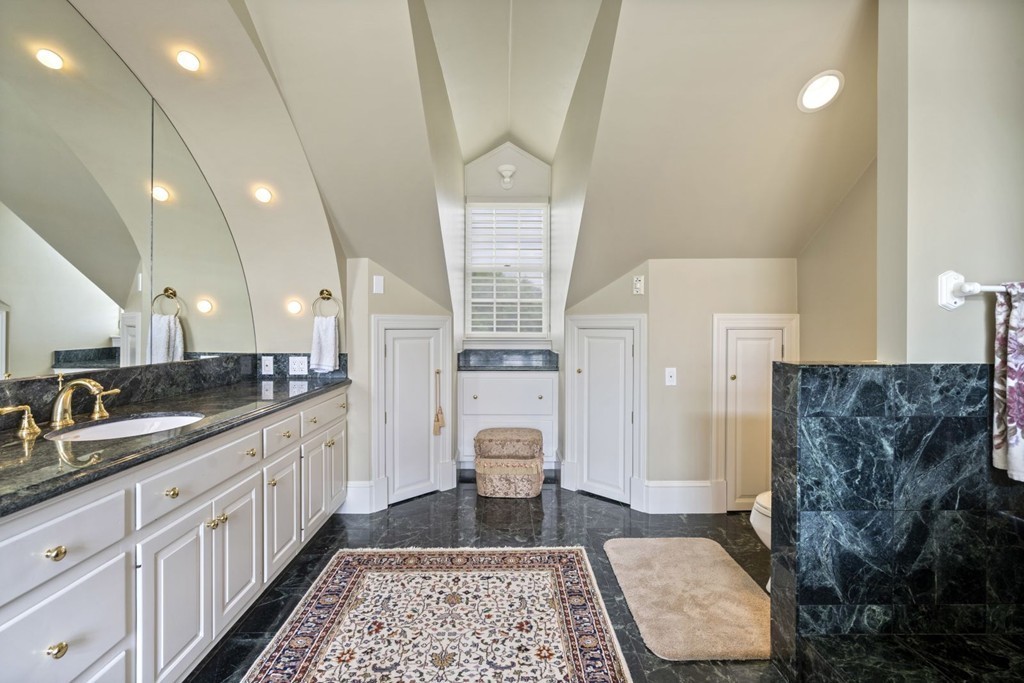 6 Monument Square, Unit 4 Boston, MA 02129 - Photo 22 of 37 a bathroom with a granite countertop sink a toilet and with mirror
