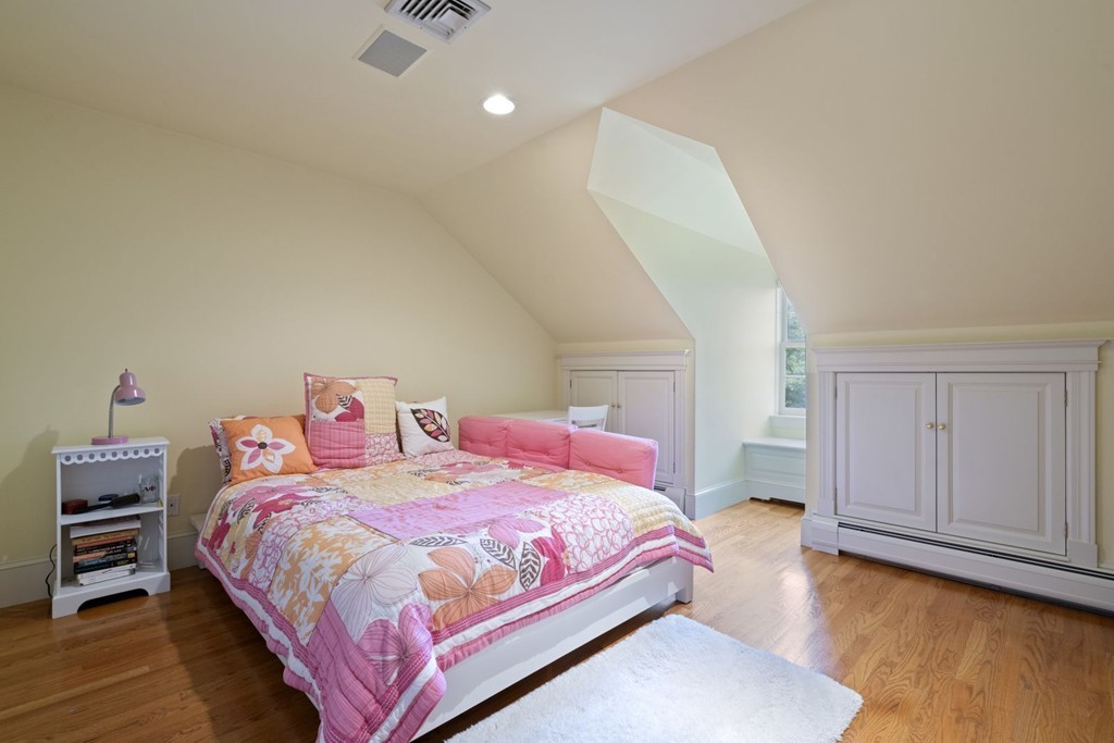 6 Monument Square, Unit 4 Boston, MA 02129 - Photo 25 of 37 a bedroom with a bed and wooden floor
