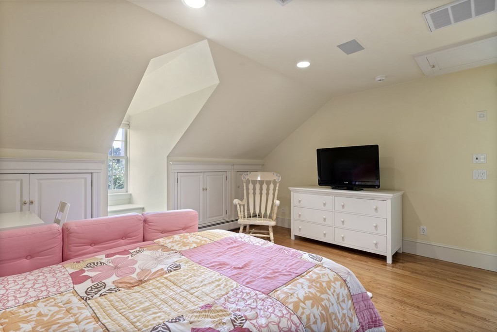 6 Monument Square, Unit 4 Boston, MA 02129 - Photo 26 of 37 a bedroom with a bed and flat screen tv