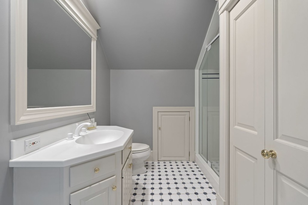 6 Monument Square, Unit 4 Boston, MA 02129 - Photo 27 of 37 a bathroom with a sink a toilet and shower