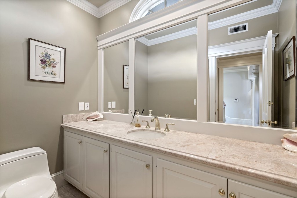 6 Monument Square, Unit 4 Boston, MA 02129 - Photo 28 of 37 a bathroom with a granite countertop sink mirror and toilet